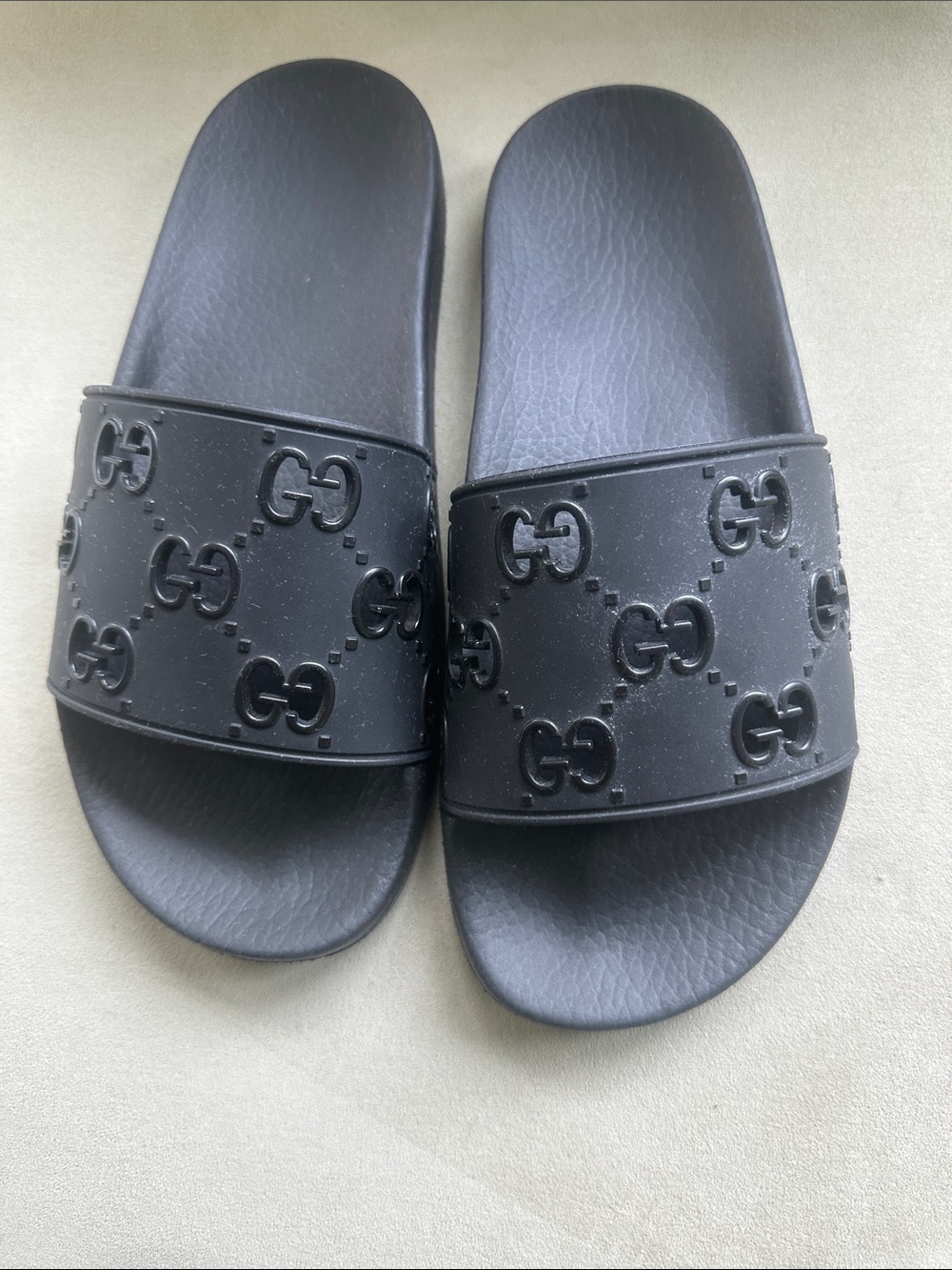Gucci Women’s Black Embossed GG Rubber Slides